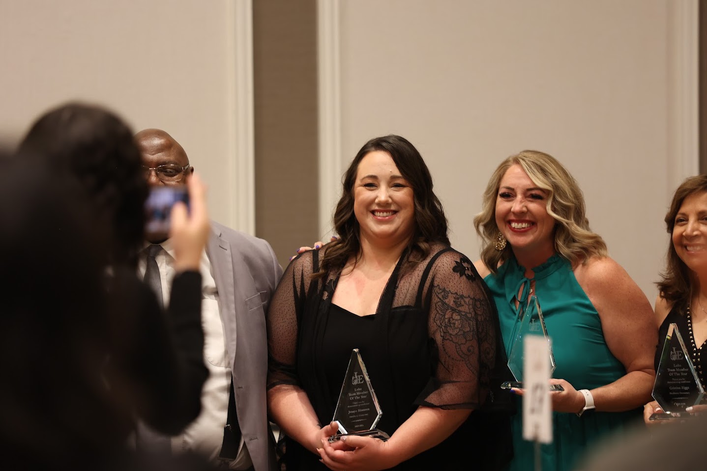 Teachers taking a picture after winning Lobo Honoree Award